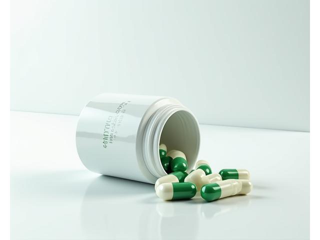 An open container of a 'Dynamic Joint Support' supplement, showing capsules clearly.